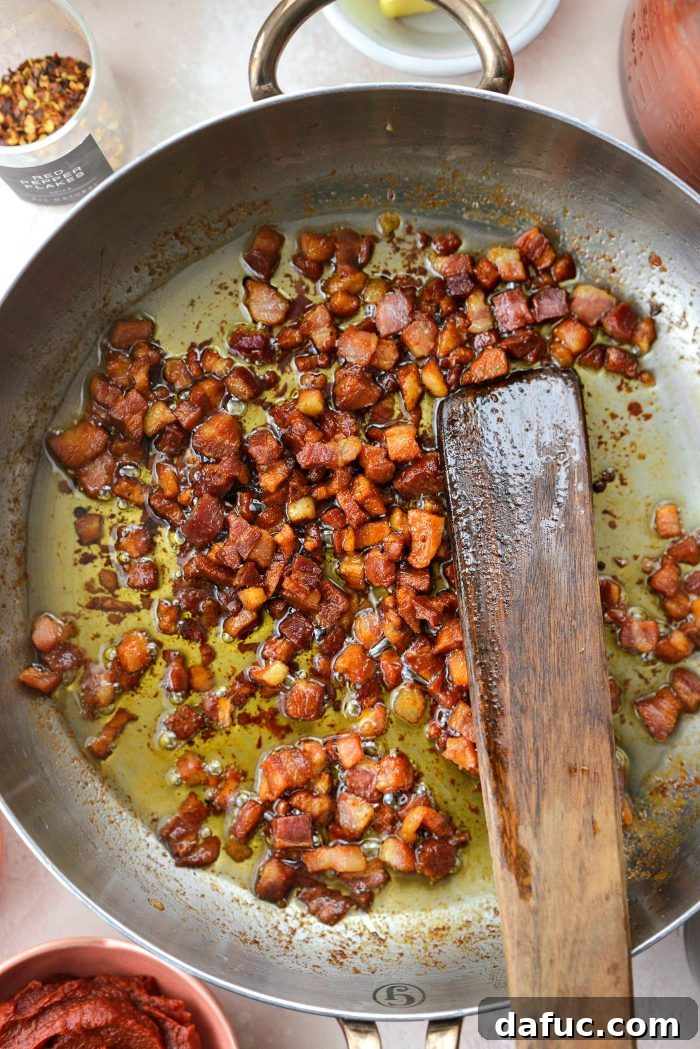 Creamy Blush Pasta 7 Crispy golden pancetta in a skillet