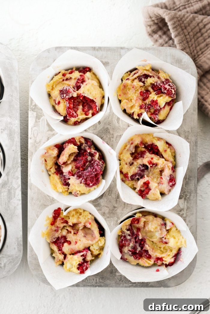 Dividing muffin batter evenly among lined muffin cups