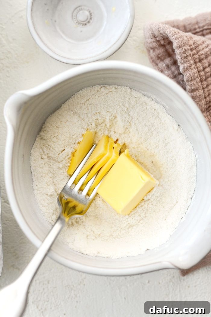 Adding softened butter to streusel dry ingredients and cutting it in with a fork