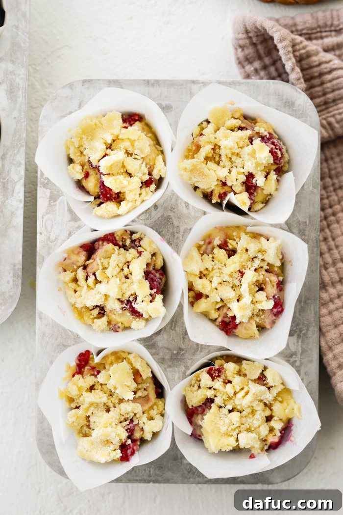 Muffins topped with streusel, ready for baking