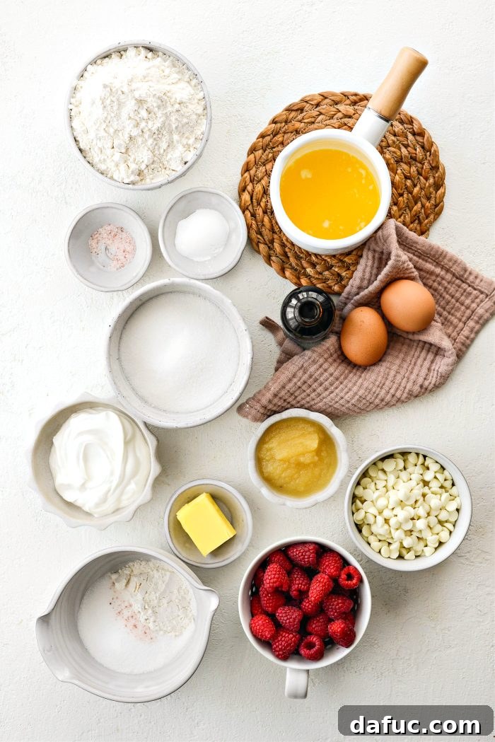 Ingredients for Raspberry White Chocolate Streusel Muffins laid out on a kitchen counter
