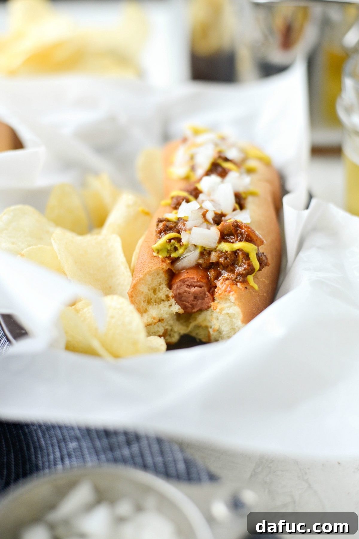 Finished Detroit Coney Dogs Final image of two Detroit Style Coney Dogs on a serving plate