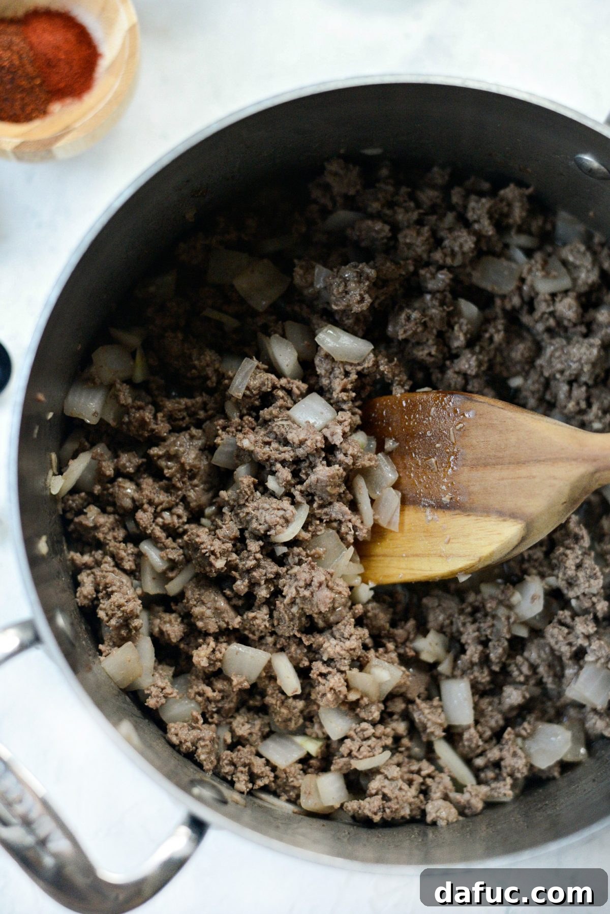 Browning Beef for Chili Sautéing ground beef, onions, and garlic for the coney chili
