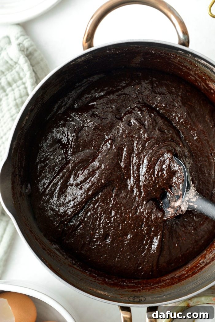 The finished, rich chocolate brownie batter in a mixing bowl