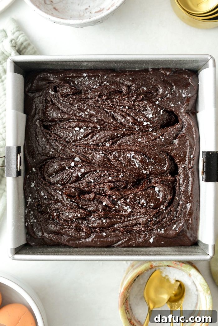 The brownie pan baking on the middle rack of a preheated oven