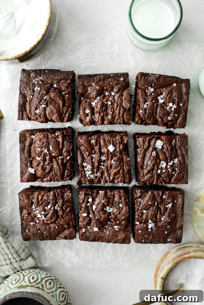 Perfectly cooled and cut Salted Fudge Brownies on a serving board