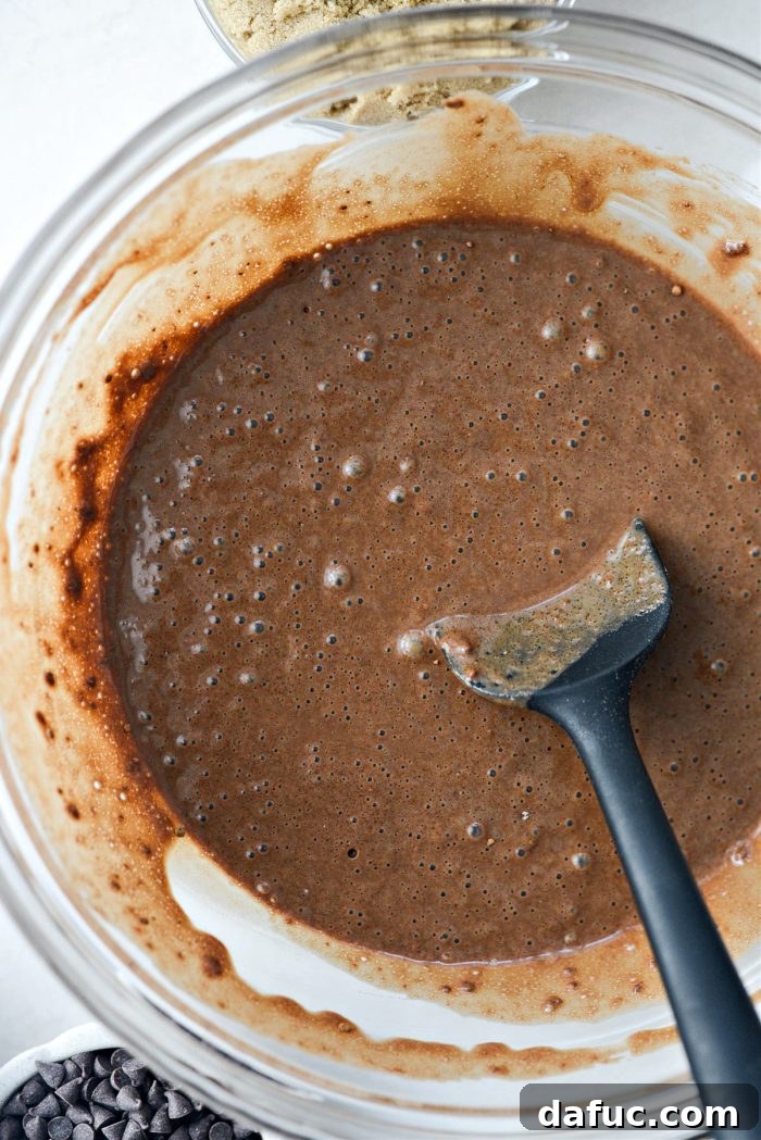 Mixing the Chocolate Pudding Cake batter until it is smooth and well combined