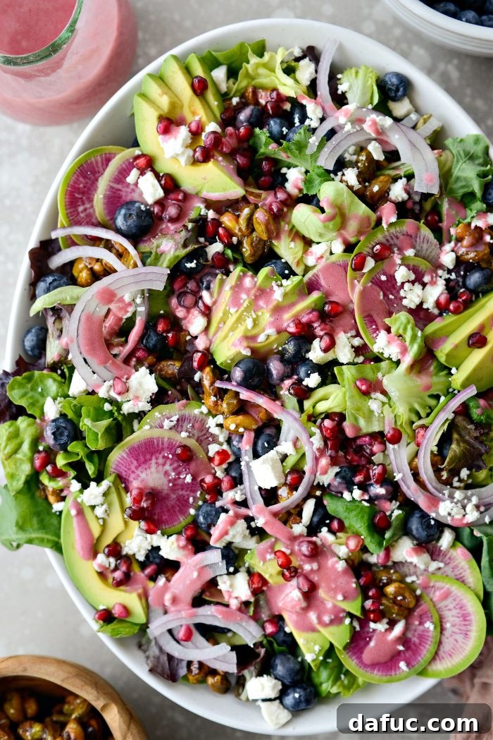 Vibrant Blueberry Pistachio Spring Salad with creamy pomegranate dressing, a perfect light meal.