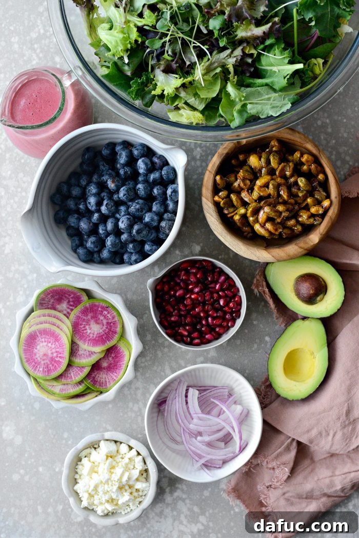 Key ingredients laid out for making the Blueberry Pistachio Spring Salad.