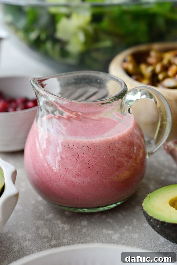 Ingredients for homemade pomegranate vinaigrette, blended until smooth.