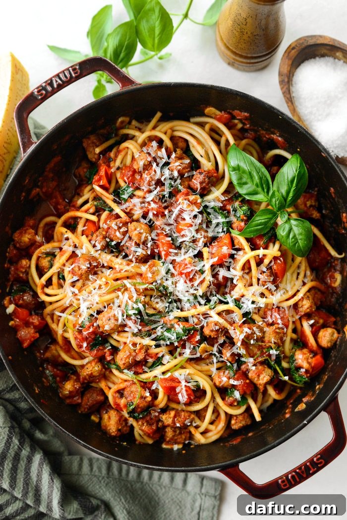 Hearty Sausage and Kale Pasta with Burst Tomatoes 2 Serve with fresh basil and freshly grated Parmesan cheese, a vibrant and comforting Italian Sausage, Kale, and Blistered Tomato Fettuccine pasta dish.