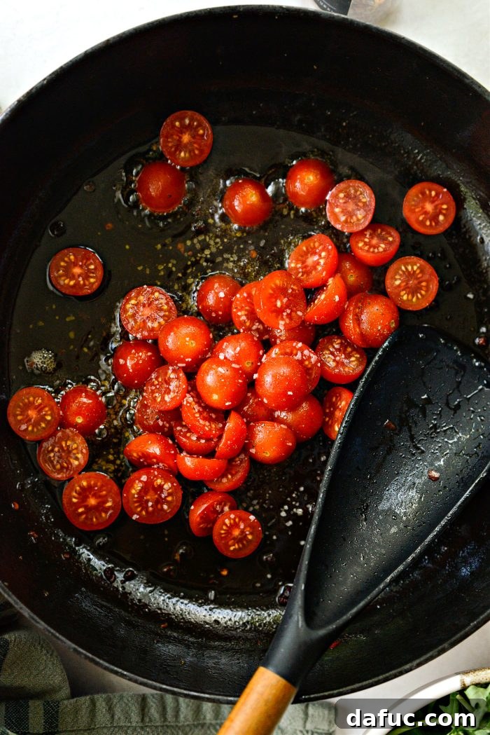 Hearty Sausage and Kale Pasta with Burst Tomatoes 9 Add cherry tomato halves, salt, and pepper to the remaining fat in the pan, allowing them to blister.