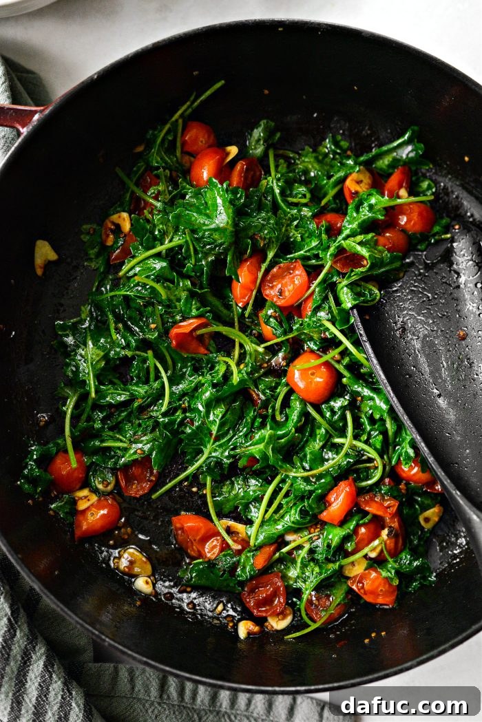 Hearty Sausage and Kale Pasta with Burst Tomatoes 10 Once tomatoes are blistered, add baby kale and thinly sliced garlic to the skillet and cook until just wilted.