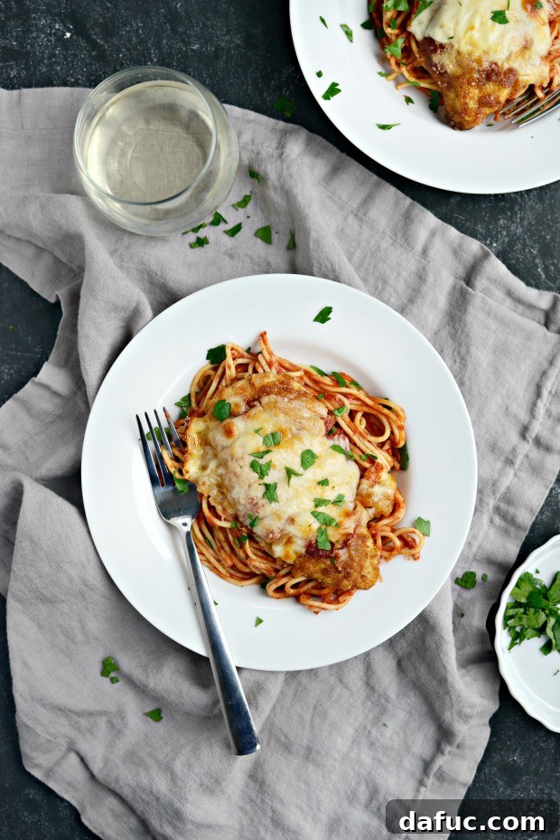 Homemade Chicken Parmesan served with spaghetti