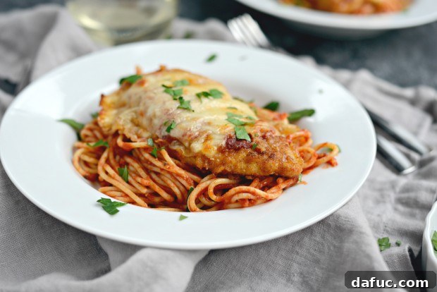 Bubbly, golden Chicken Parmesan fresh from the oven