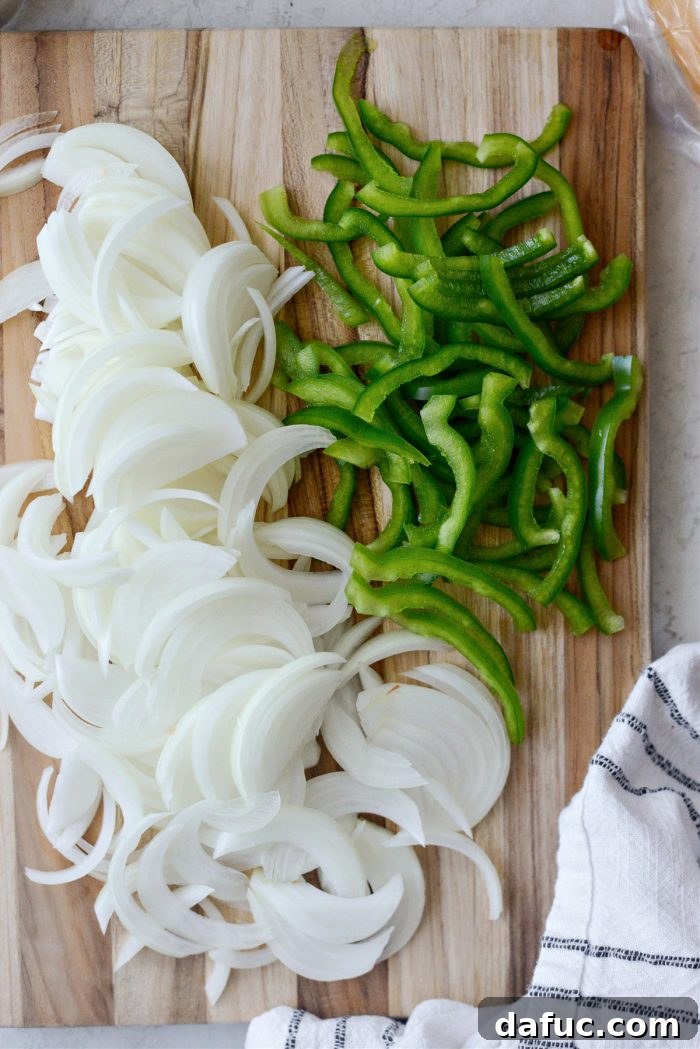 Melty, Meaty Philly Cheesesteak Magic 4 sliced green pepper and yellow onion