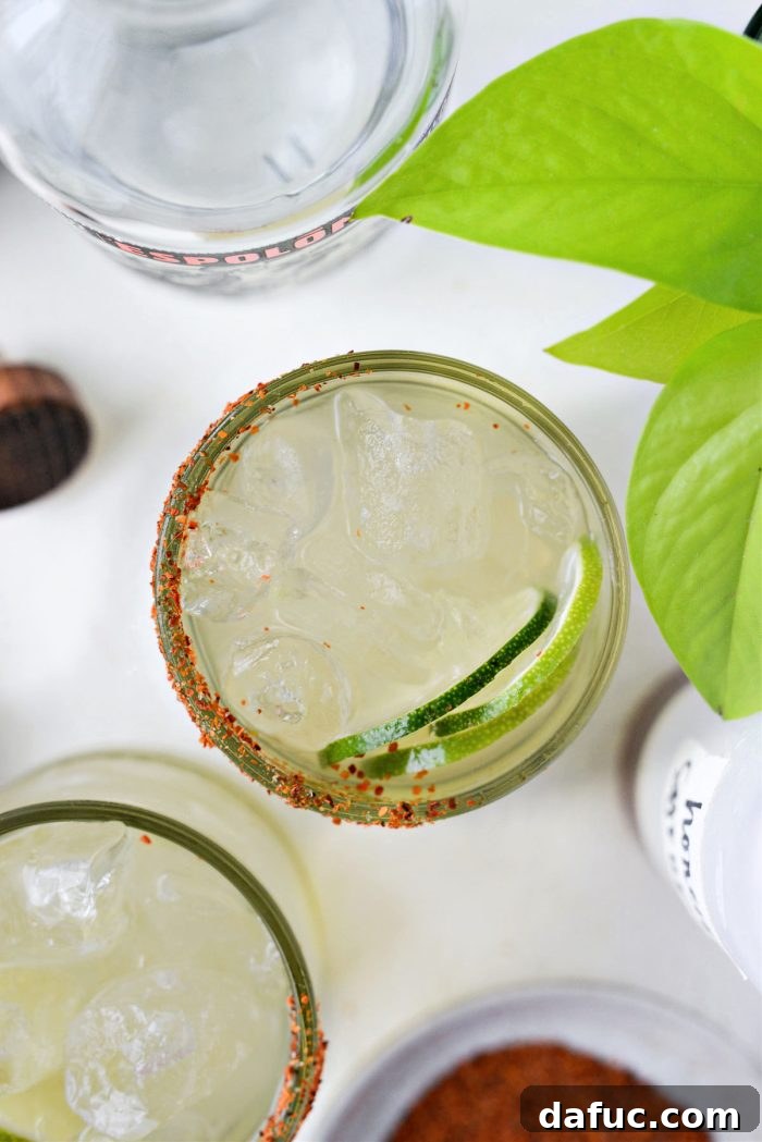 A close-up shot of a Honey Lime Margarita glass with condensation.