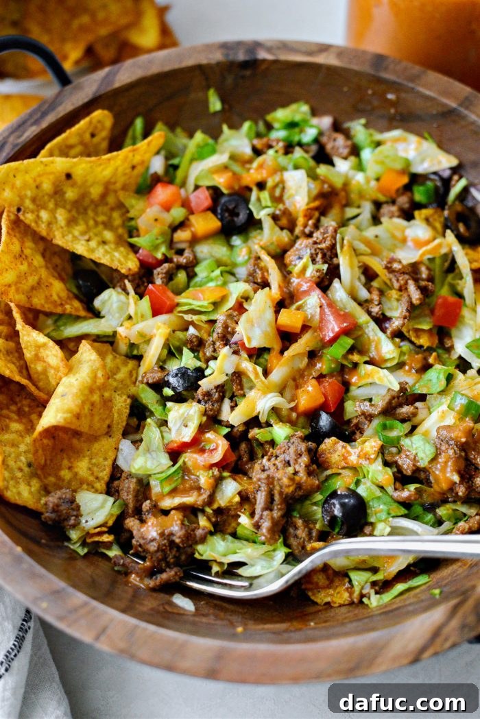 Loaded Chopped Taco Salad 11 A bowl of freshly made chopped taco salad with a fork.