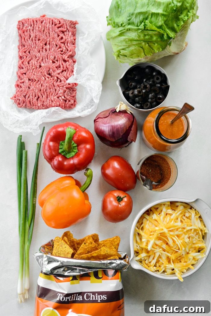 Loaded Chopped Taco Salad 4 A selection of fresh ingredients laid out on a cutting board, ready for the chopped taco salad.