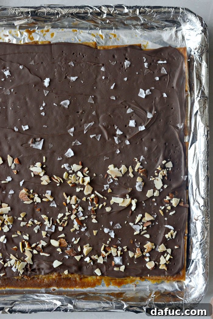 Salty Sweet Toffee Crunch 13 The pan of Saltine Toffee being placed in the fridge to allow the chocolate and toffee to set.