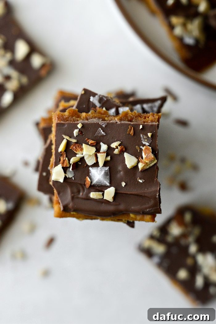 Close-up of a plate of Saltine Toffee, highlighting the delicious chocolate and toffee layers, ready to be enjoyed.