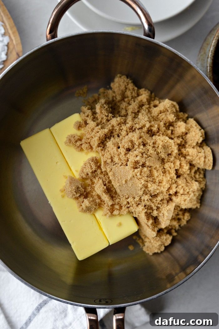 Salty Sweet Toffee Crunch 6 Unsalted butter and dark brown sugar added to a saucepan, beginning the toffee-making process.