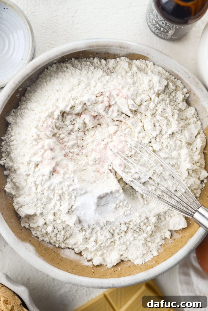 Gourmet White Chocolate Macadamia Nut Treasures 5 Combining dry ingredients for cookie dough