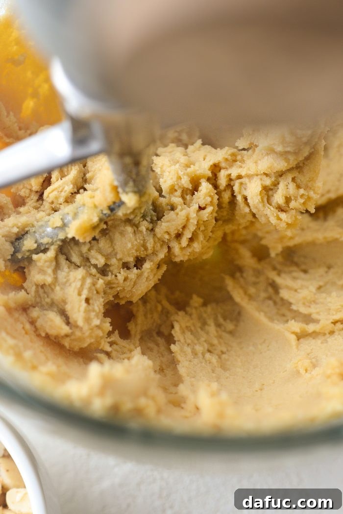 Gourmet White Chocolate Macadamia Nut Treasures 7 Mixing butter and sugars for 3 minutes until smooth
