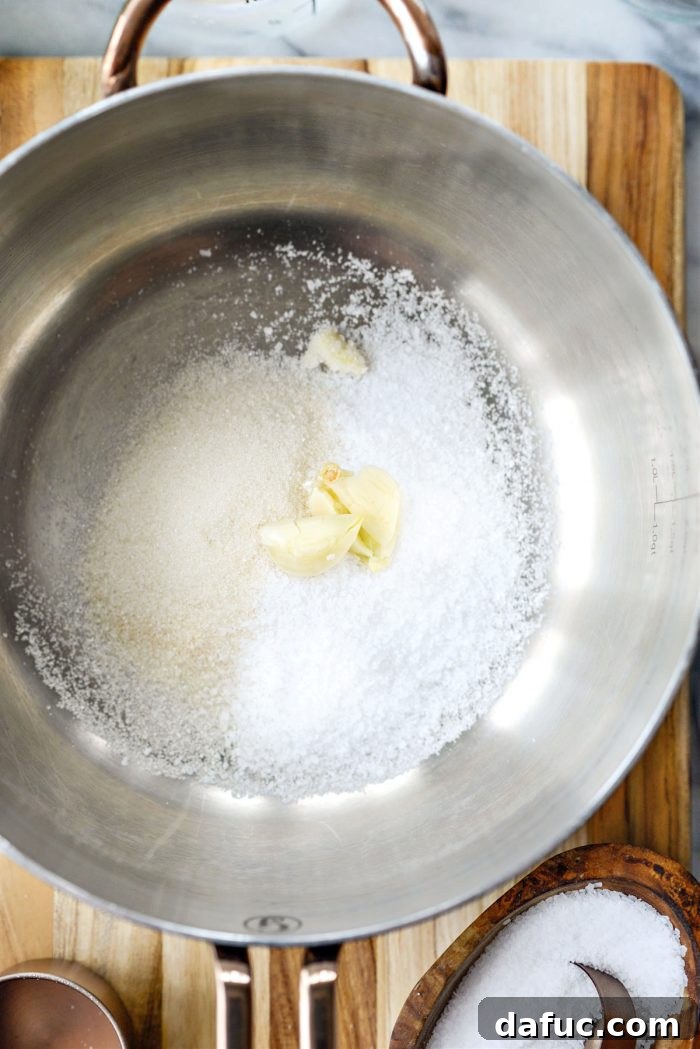 add sugar, salt and garlic to saucepan