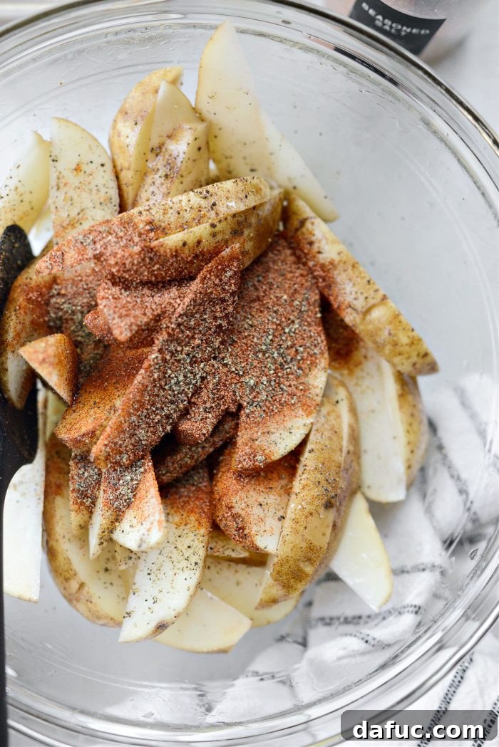 Crispy Seasoned Steak Fries 8 Tossing potato wedges with avocado oil, then adding all-purpose seasoning and freshly ground black pepper