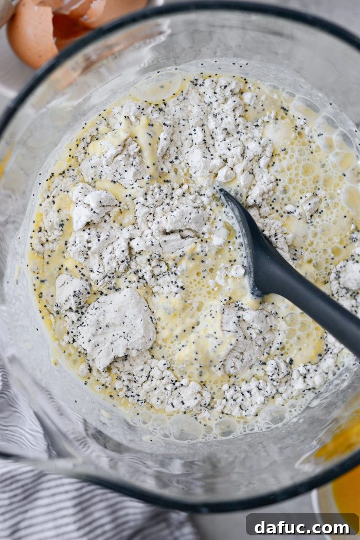 Gently stirring pancake batter with a spatula