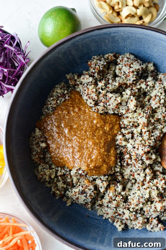 Vibrant Thai Quinoa Salad with Cashew Crunch 8 quinoa and dressing in serving bowl