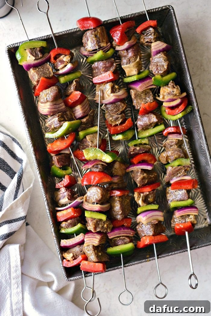Steak, bell peppers, and onions perfectly threaded onto metal skewers