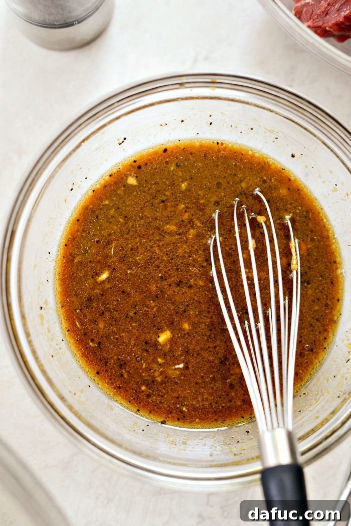 Whisked homemade marinade in a glass bowl, ready for use
