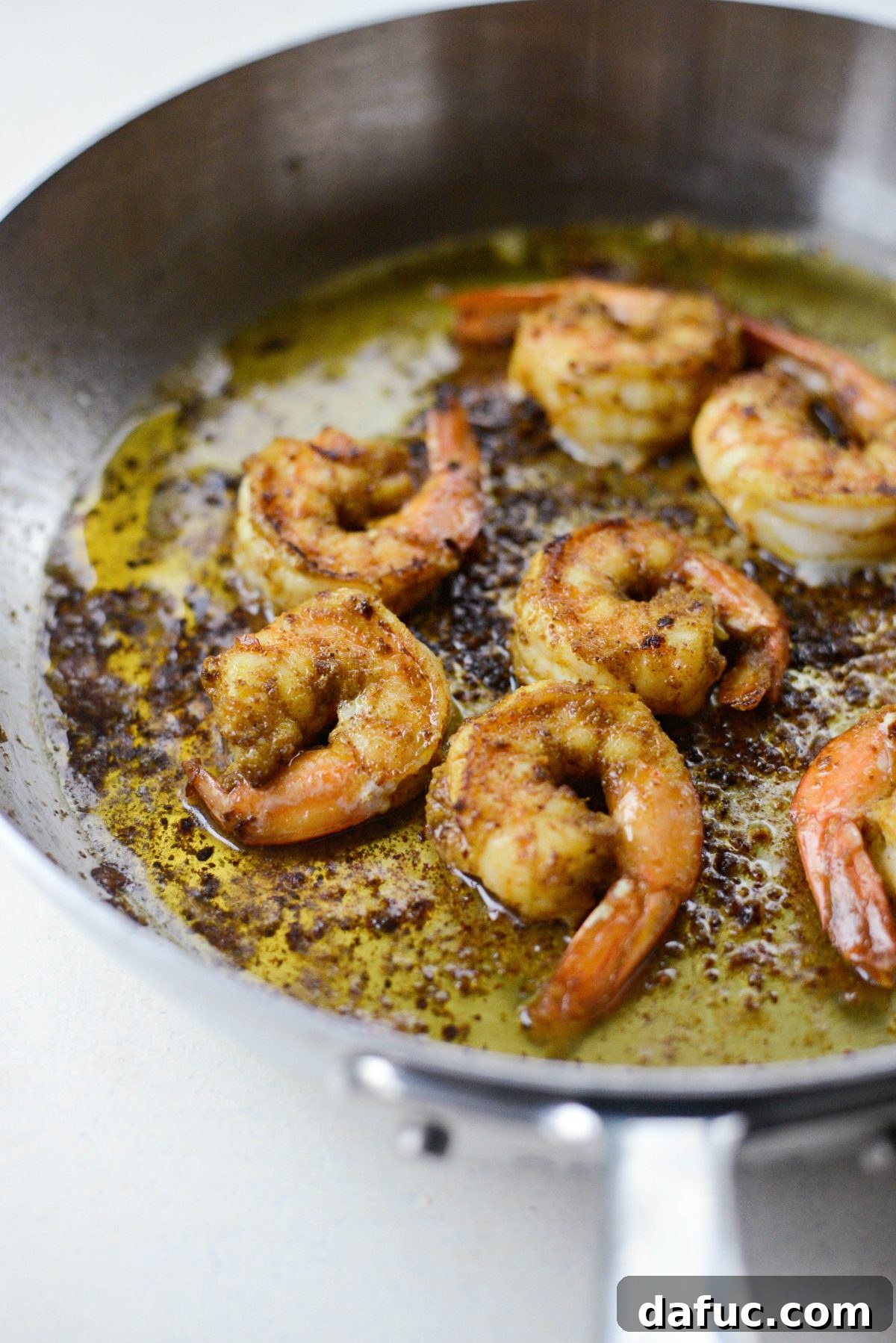 Aromatic North African Shrimp with Vibrant Summer Couscous 12 Searing spiced North African shrimp in a hot skillet.