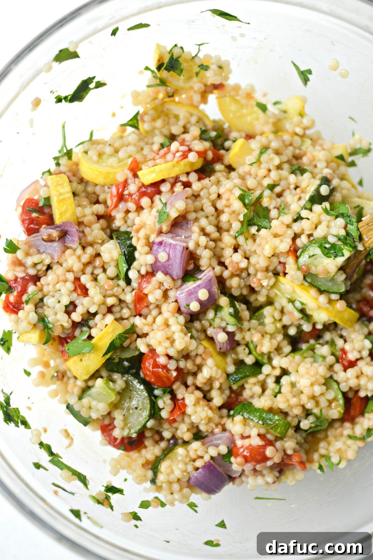 Aromatic North African Shrimp with Vibrant Summer Couscous 16 Adding roasted vegetable juices to the couscous mixture.