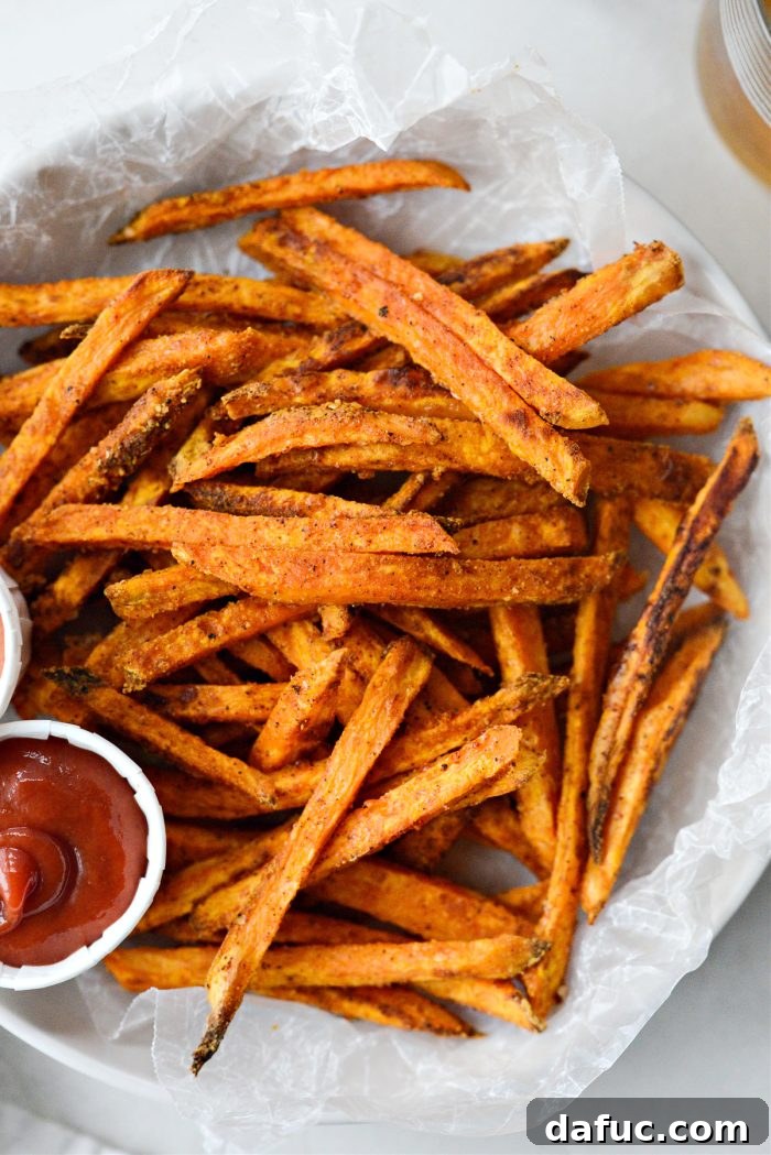 Perfectly crispy baked sweet potato fries ready to be served