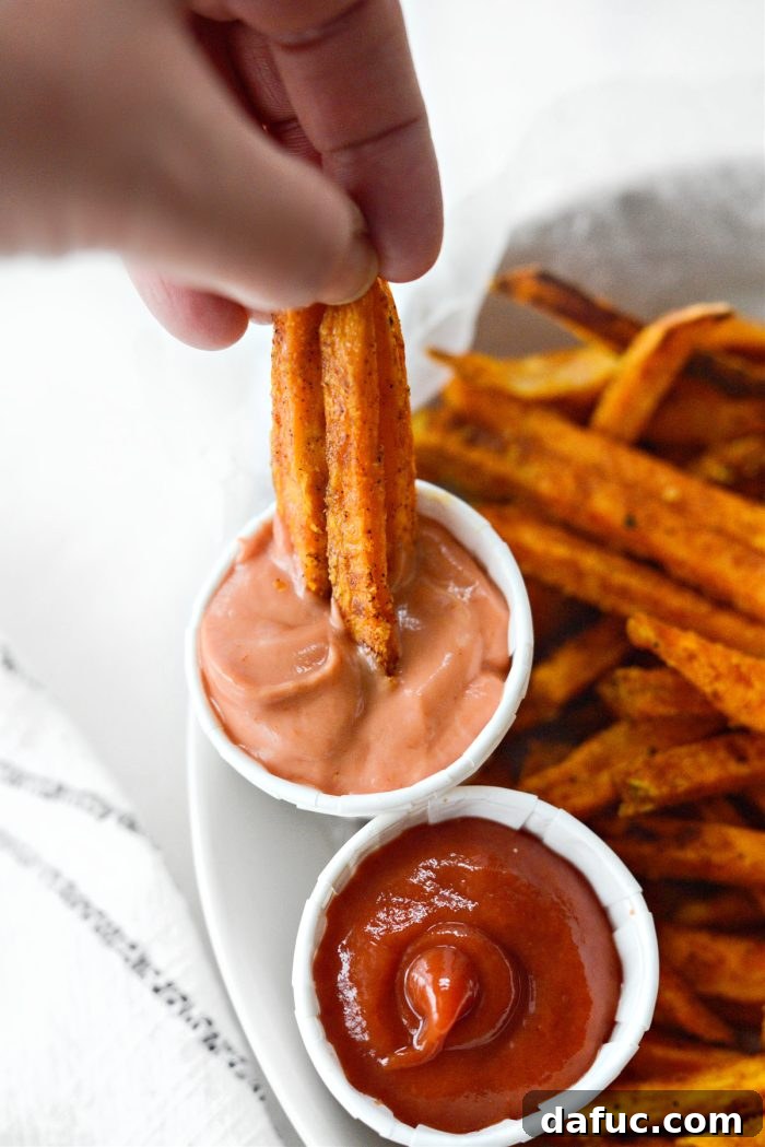 A final close-up of a serving of crispy sweet potato fries, emphasizing their texture and color