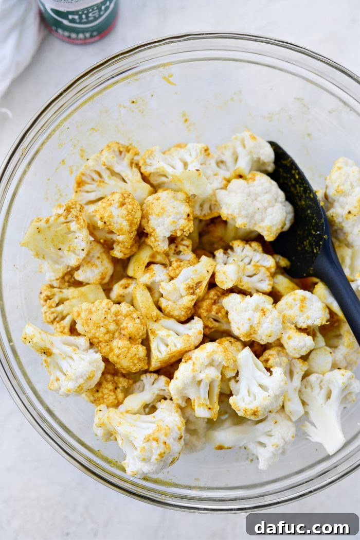 Golden Curry Roasted Cauliflower 7 Tossing cauliflower in curry sauce