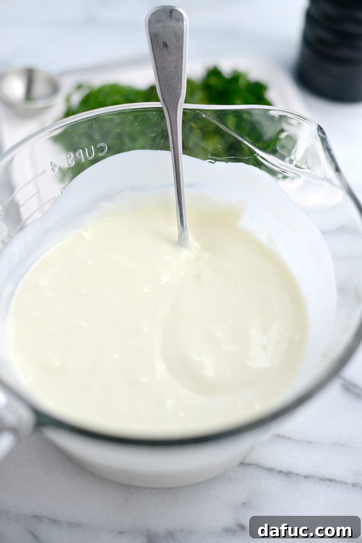 Farmhouse Ranch 6 Stirring the buttermilk ranch dressing ingredients together until smooth