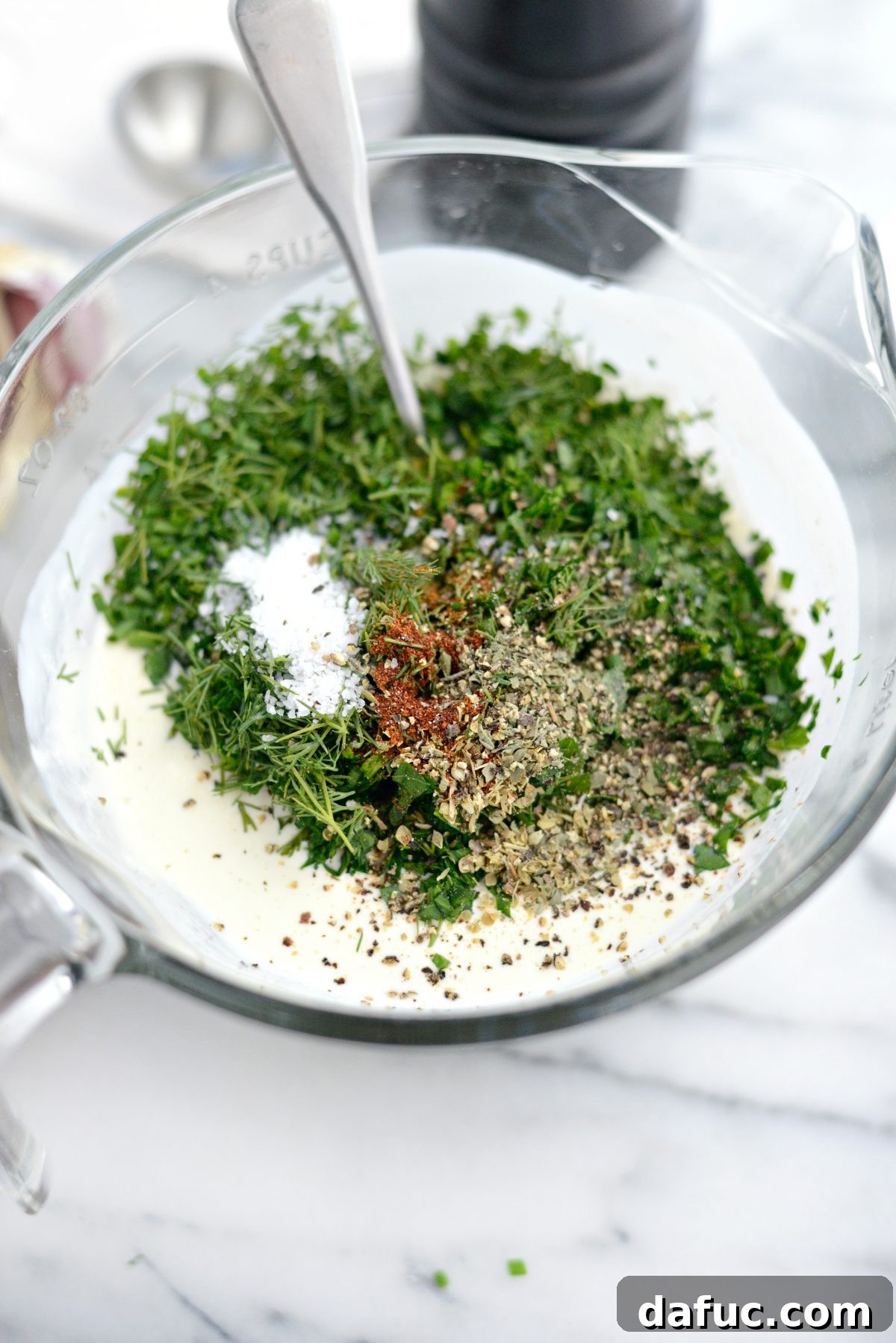 Farmhouse Ranch 8 Adding fresh herbs and dried spices to the creamy buttermilk ranch dressing base