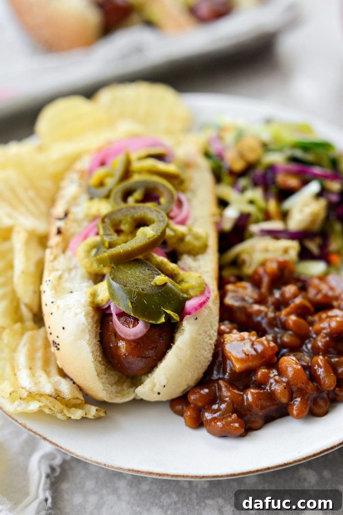 Smoky BBQ Glazed Chicken Brats 13 Another enticing shot of a Grilled BBQ Sauce Chicken Brat, showcasing its readiness to be enjoyed.