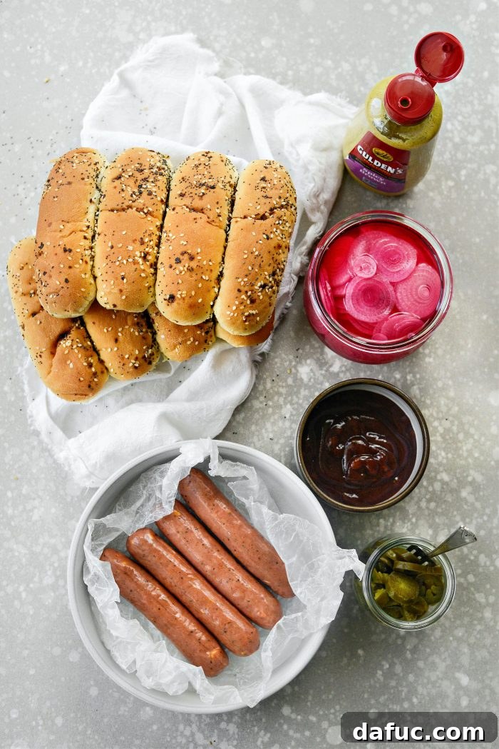 Smoky BBQ Glazed Chicken Brats 4 A colorful array of ingredients for Grilled BBQ Sauce Chicken Brats, including brats, buns, sauce, and toppings.
