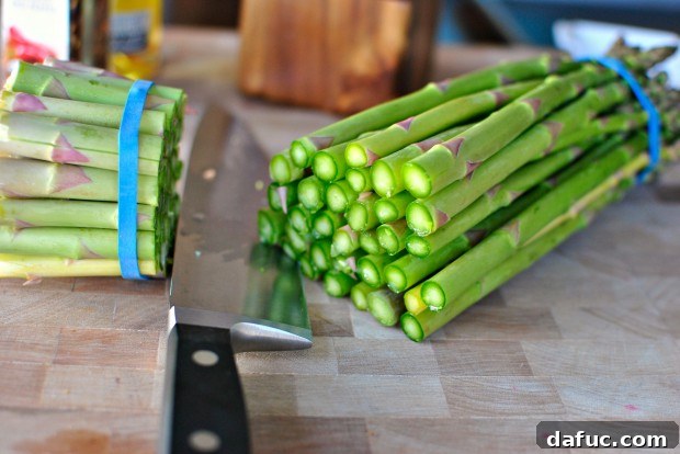 Trimming the woody ends of asparagus
