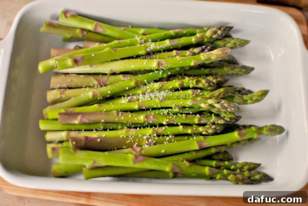 Sprinkling kosher salt on asparagus
