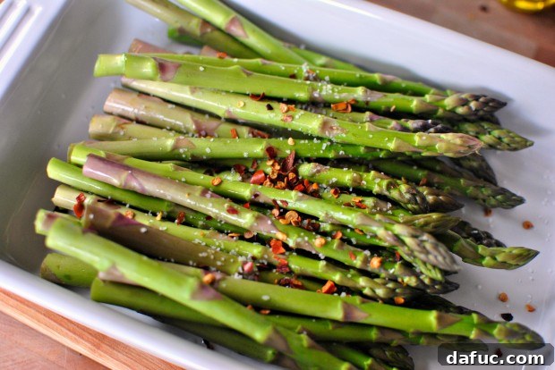 Adding red pepper flakes to asparagus