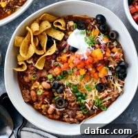 Slow Cooker Taco Chili, a hearty and easy homemade chili recipe for game day or family meals.