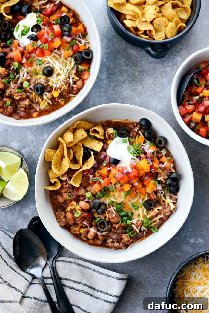 Fiesta Slow Cooker Taco Chili 3 Close-up of Slow Cooker Taco Chili simmering in the crock pot, showing rich texture with beans, corn, and ground beef. Perfect for an easy, flavorful meal.