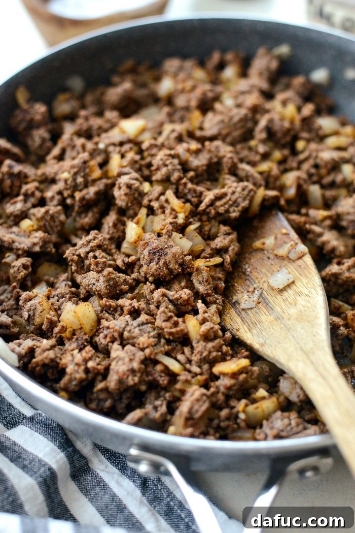 Fiesta Slow Cooker Taco Chili 6 The ground beef, onion, and garlic mixture browning in the skillet, ready for the next step in the Slow Cooker Taco Chili recipe.