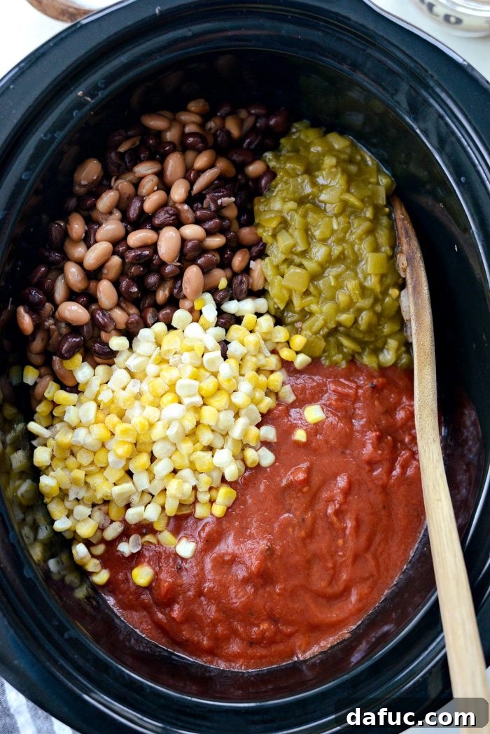 Fiesta Slow Cooker Taco Chili 8 Using a slotted spoon to transfer the seasoned ground beef and onion mixture from the skillet to the slow cooker, minimizing excess fat.